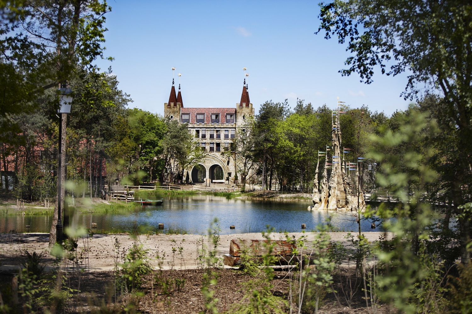 Efteling Bosrijk Village view over lake to Restaurant and pool